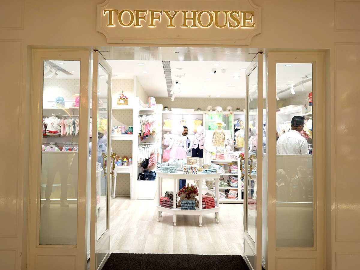 Toffy House store entrance with illuminated signage